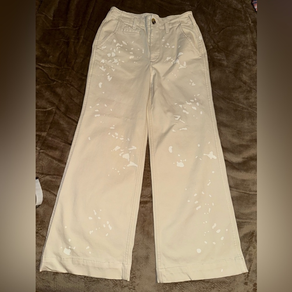 Anthropologie Pilcro Cream and White Trousers with white paint splatter